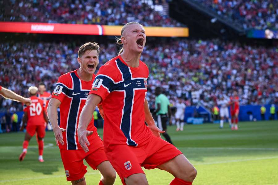 Norway's Erling Haaland (right) celebrates his first World Cup goal
