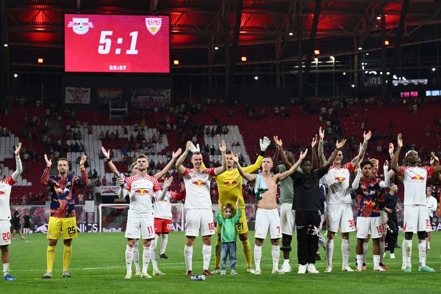 RB Leipzig's players celebrate with their fans following the victory