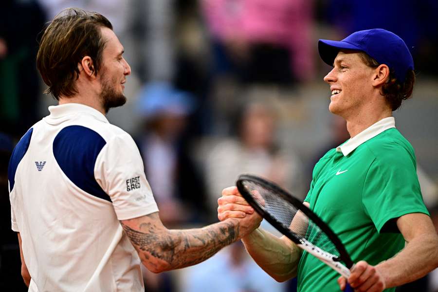 Italy's Jannik Sinner (right) shakes hands with Kazakhstan's Alexander Bublik after winning his quarter-final