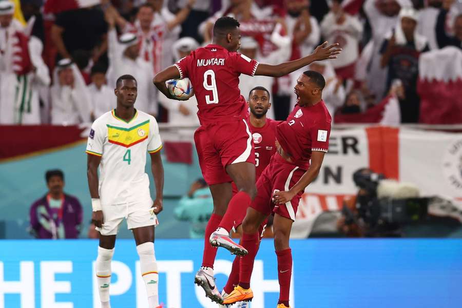 Muntari celebrates holding the ball he scored with