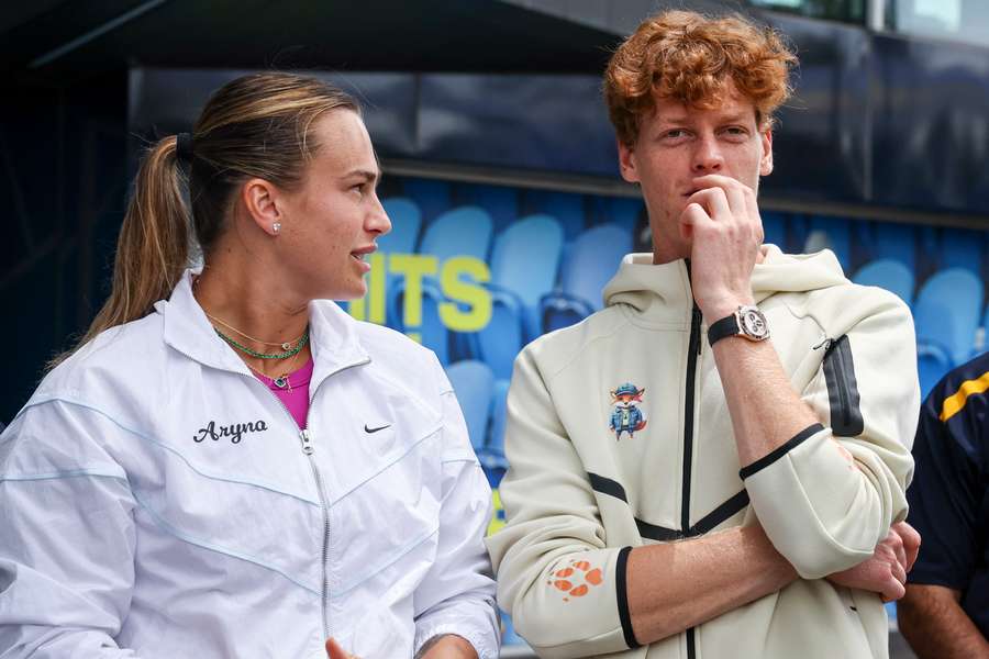 Australian Open champions Aryna Sabalenka and Jannik Sinner participate in a ceremony for the main draw