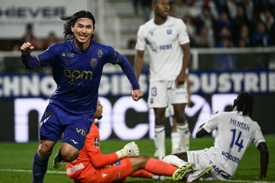 Takumi Minamino celebrates his goal for Monaco
