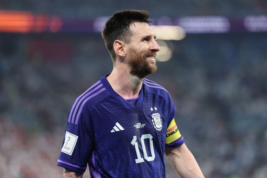 Lionel Messi smiles during Argentina's match with Poland