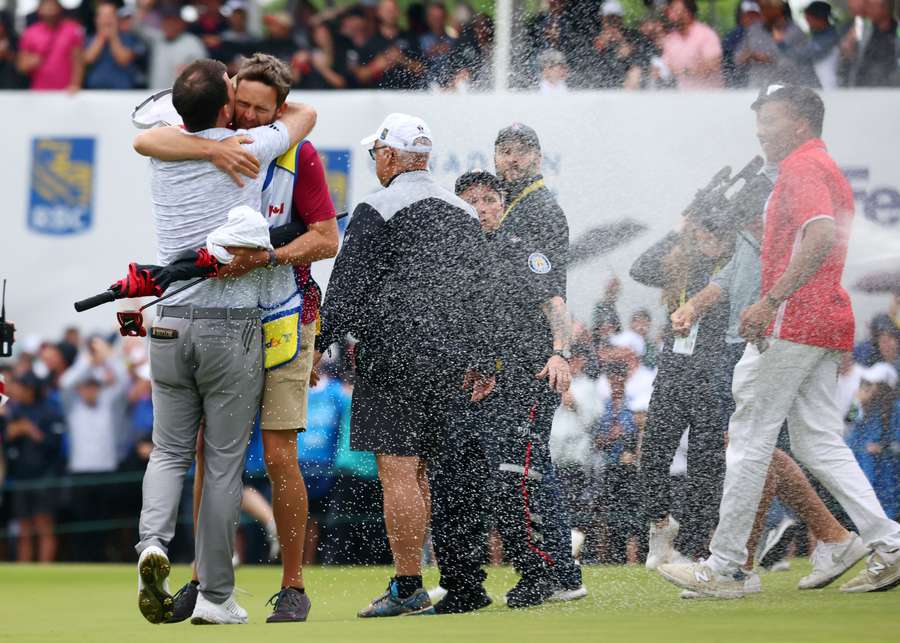 Nick Taylor of Canada celebrates with his caddie after making an eagle putt on the 4th playoff hole to win the RBC Canadian Open Nick Taylor of Canada celebrates with his caddie after making an eagle putt on the 4th playoff hole to win the RBC Canadian Open