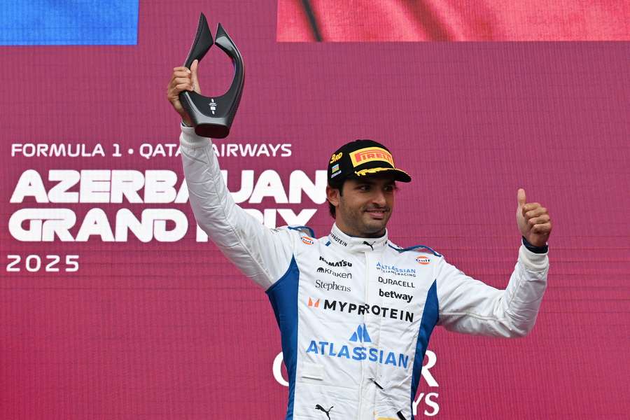 Williams' Carlos Sainz celebrates on the podium after the Azerbaijan Grand Prix