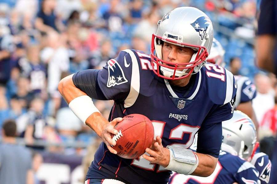 Tom Brady v dresu New England Patriots.