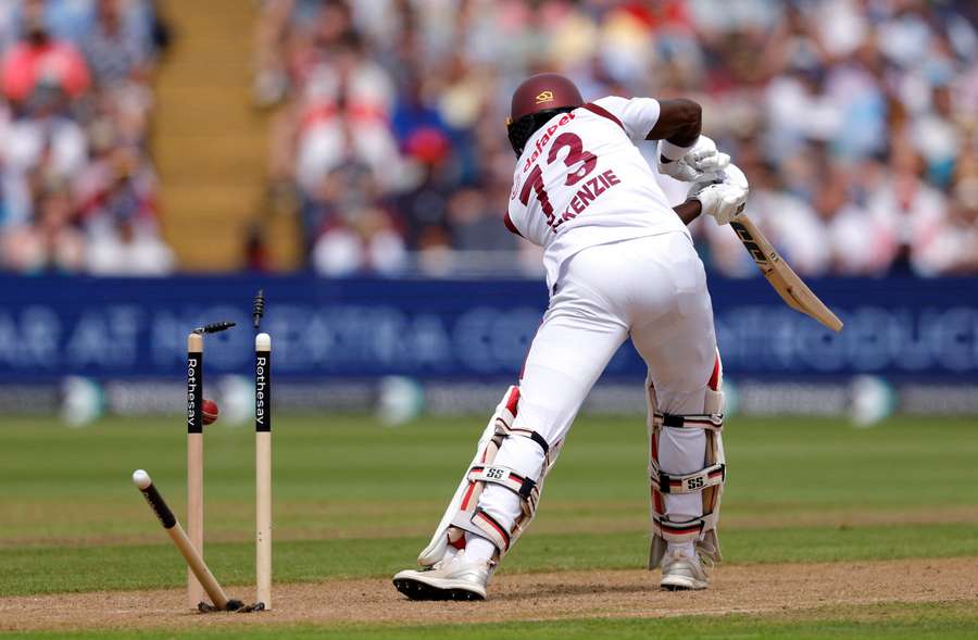 Kirk McKenzie is bowled out by Mark Wood