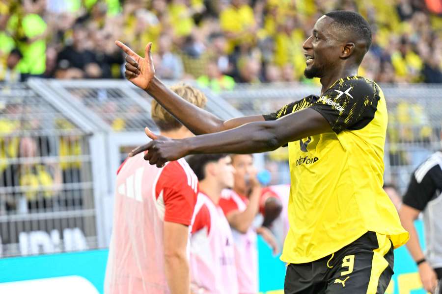 Guirassy celebrates scoring Dortmund's second goal