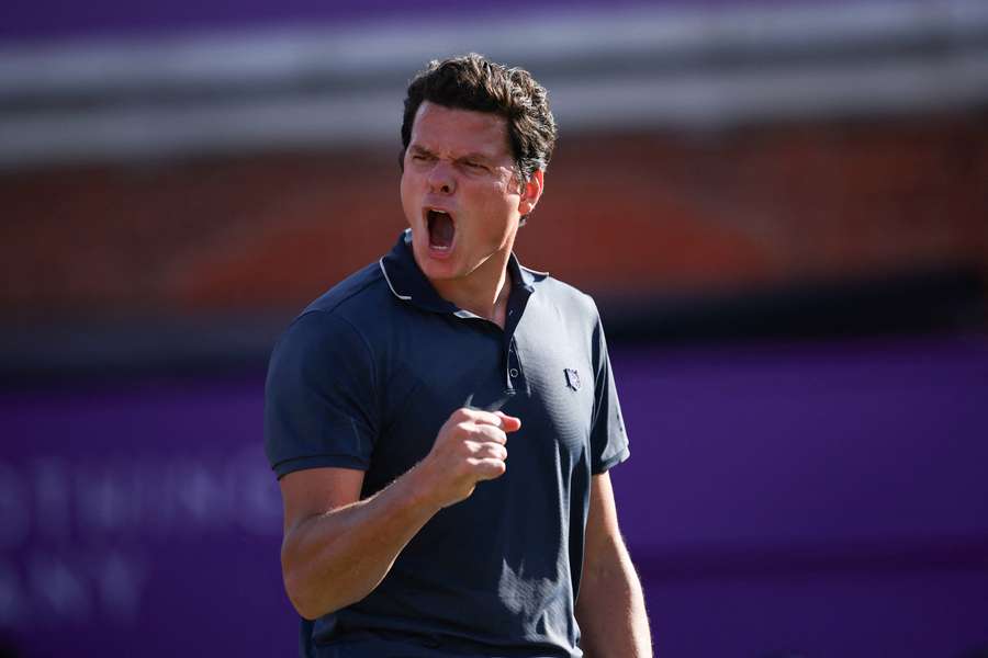Milos Raonic celebrates after beating Cameron Norrie