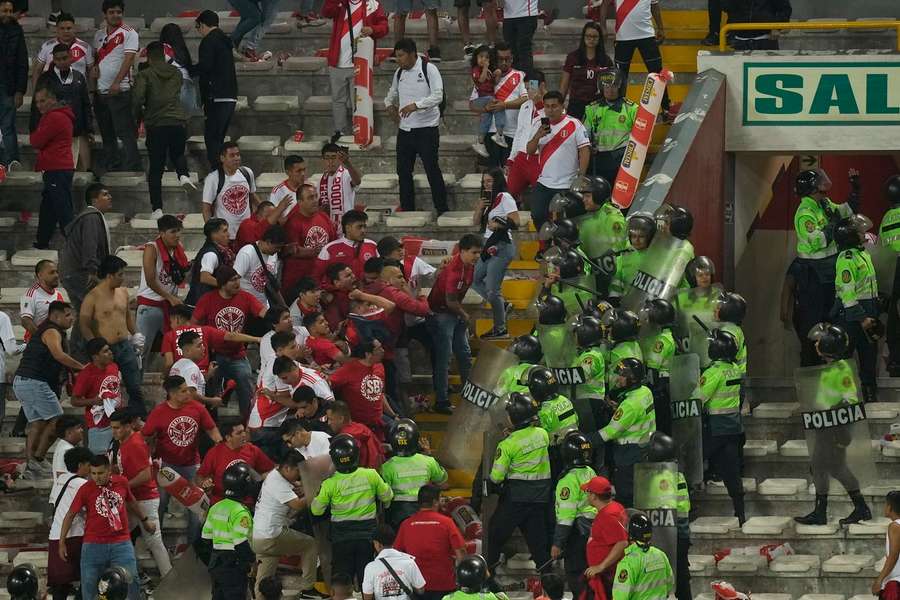 Police clash with fans at the game
