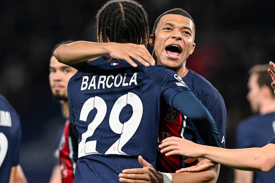Paris Saint-Germain's French forward #29 Bradley Barcola (L) celebrates with Paris Saint-Germain's French forward #07 Kylian Mbappe 