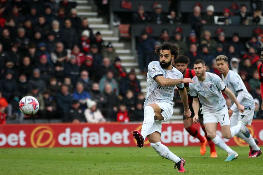 Liverpool's Egyptian striker Mohamed Salah hits this penalty kick wide of the Bournemouth goal