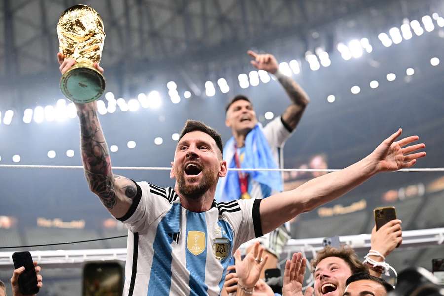 Lionel Messi with the World Cup trophy