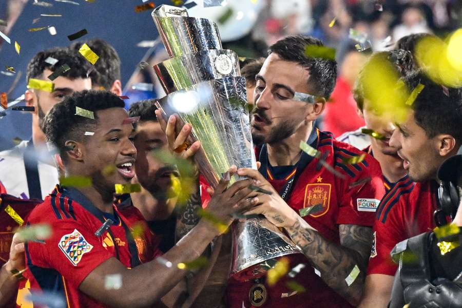 Joselu kisses the Nations League trophy after Spain beat Croatia in the final