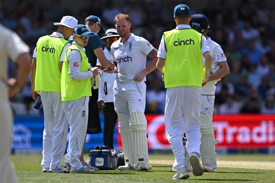 Ben Stokes receives medical attention after picking up an injury on day two of the third Ashes Test match