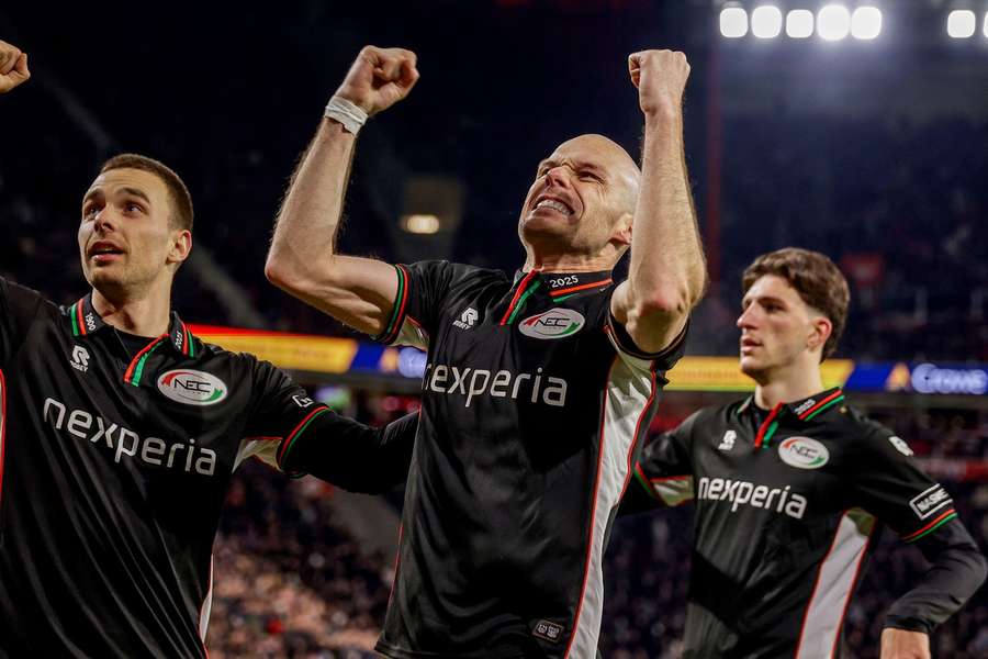 NEC's Darko Nejasmic (L), Bram Nuytinck and Ahmetcan Kaplan celebrate Youssef El Kachati's 3-1 against PSV NEC's Darko Nejasmic (L), Bram Nuytinck and Ahmetcan Kaplan celebrate Youssef El Kachati's 3-1 against PSV