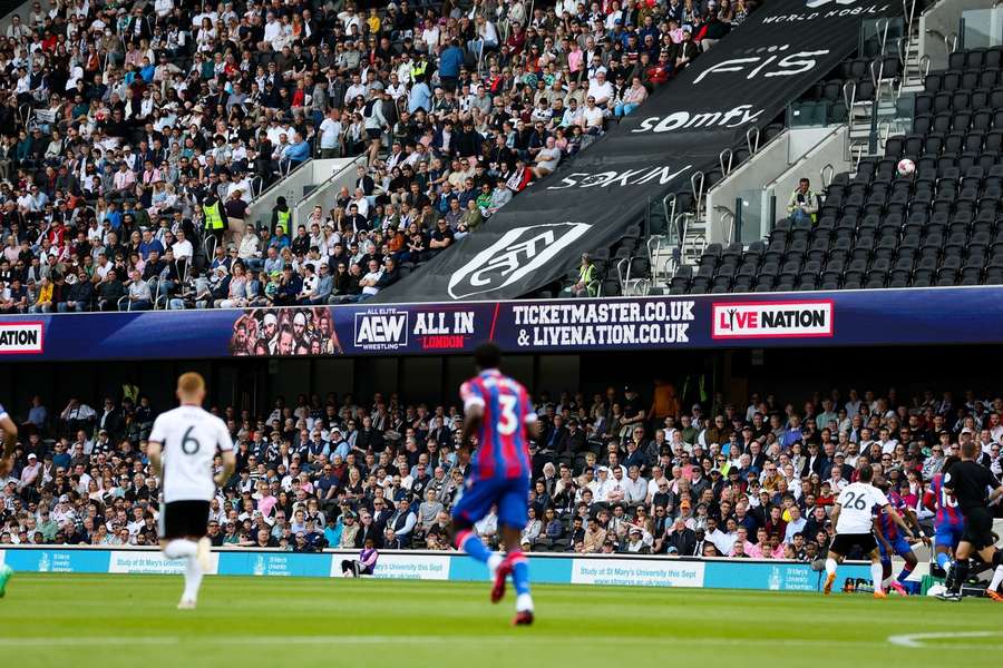 Fans watch on during the match between Fulham and Crystal Palace at Craven Cottage