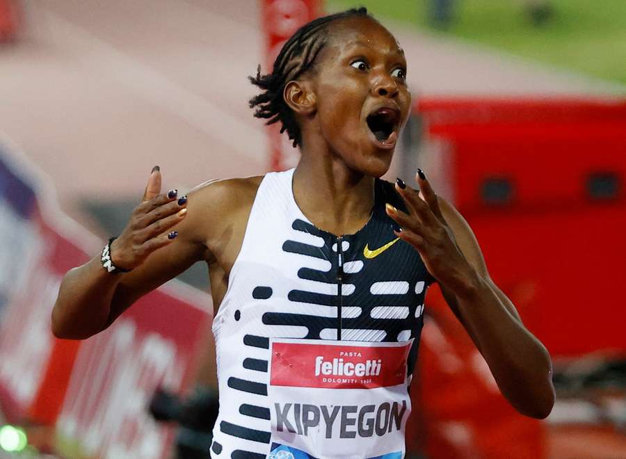Faith Kipyegon reacts after breaking the 5,000m world record