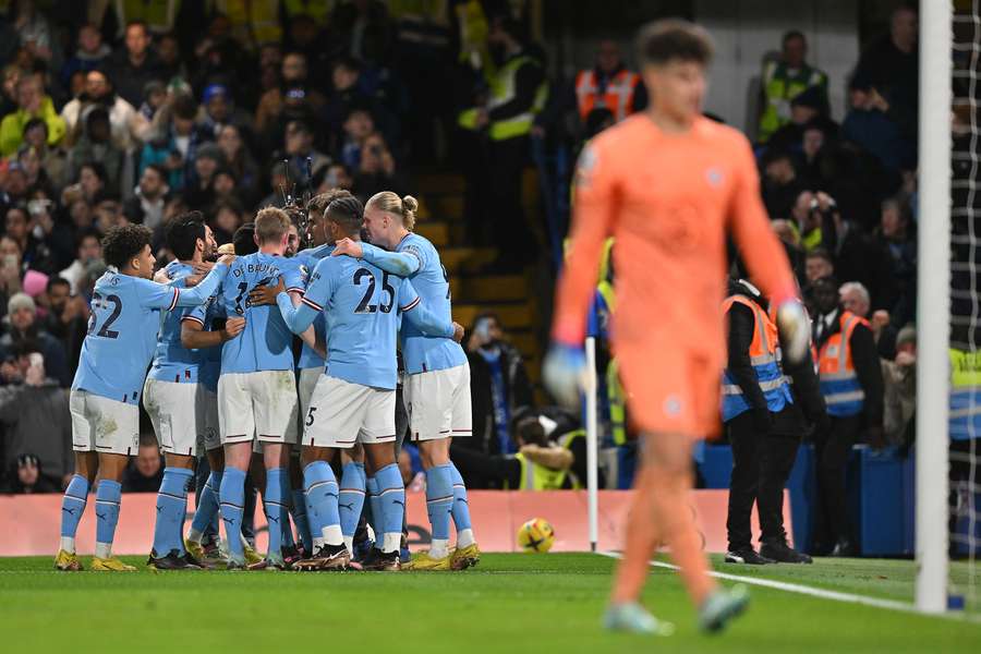 Manchester City players celebrate taking the lead against Chelsea in the 63rd minute