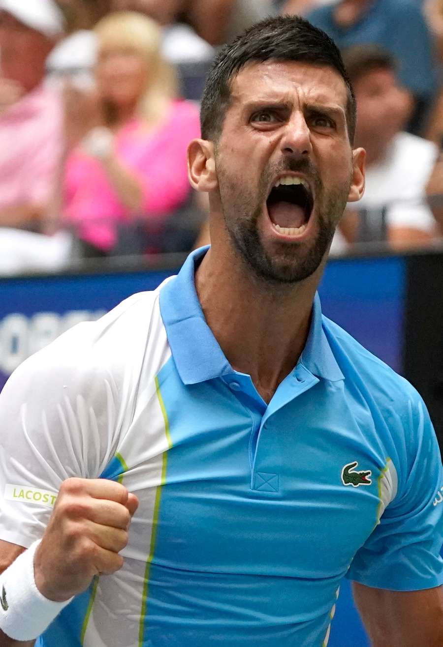 Novak Djokovic reacts while facing Taylor Fritz in the US Open quarter-finals