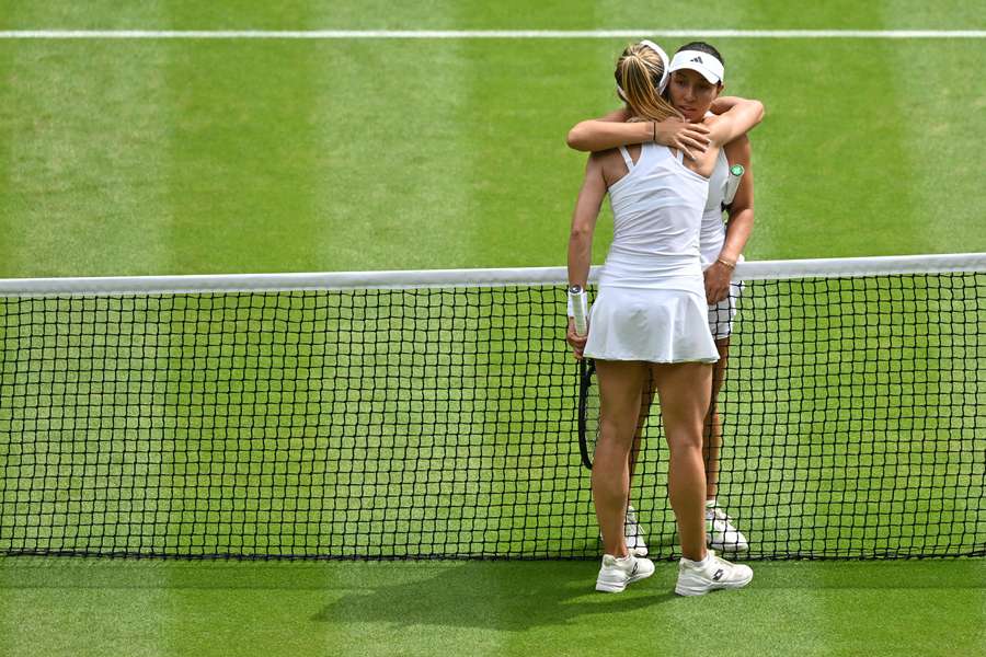 US player Jessica Pegula (R) hugs Ukraine's Lesia Tsurenko after winning their women's singles tennis