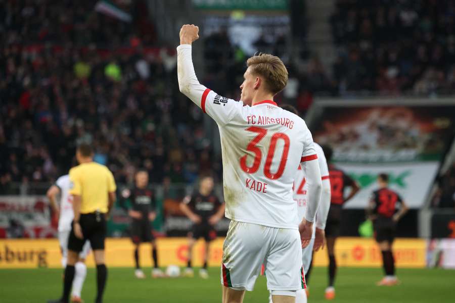 Anton Kade celebrates after scoring for Augsburg against Bayer Leverkusen Anton Kade celebrates after scoring for Augsburg against Bayer Leverkusen