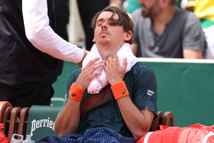 Alex de Minaur sits on his bench at the change of ends during his defeat to Alexander Bublik on Thursday