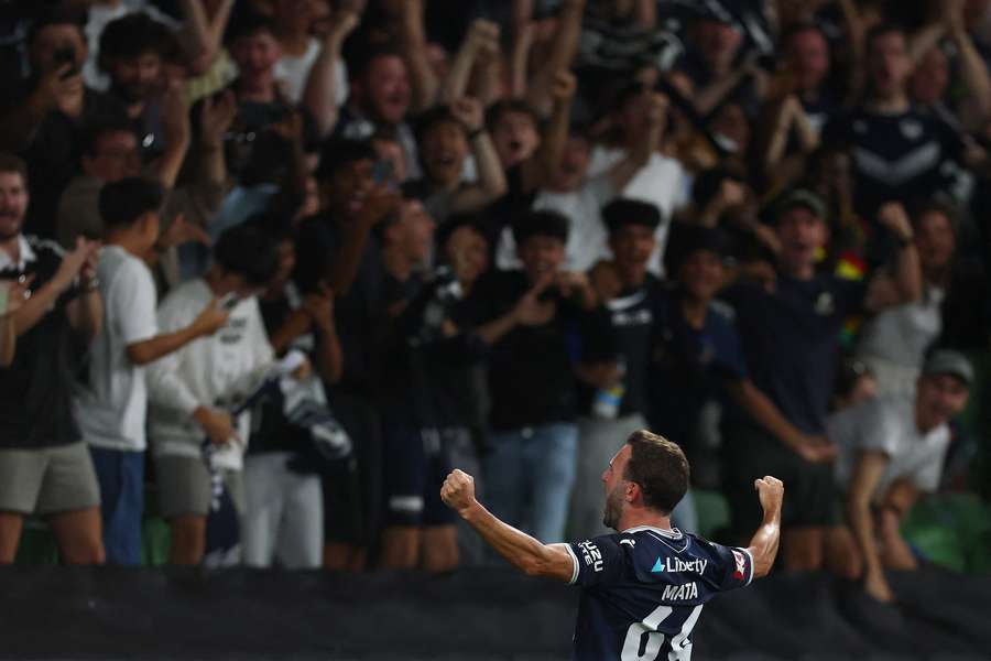 Juan Mata celebrates a goal scored in a Melbourne derby earlier this season. 