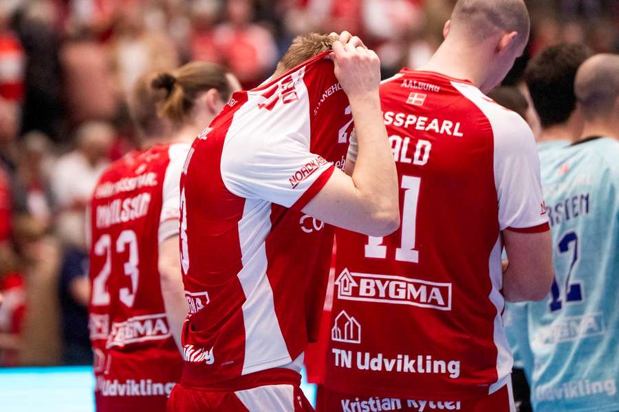 Disappointed Aalborg players after the defeat