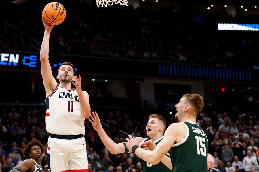 Alex Karaban scores against Michigan State