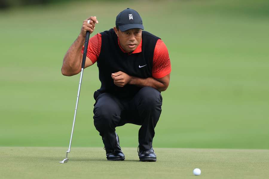 Tiger Woods lines up a putt on the third hole during the final round of the 2022 PNC Championship