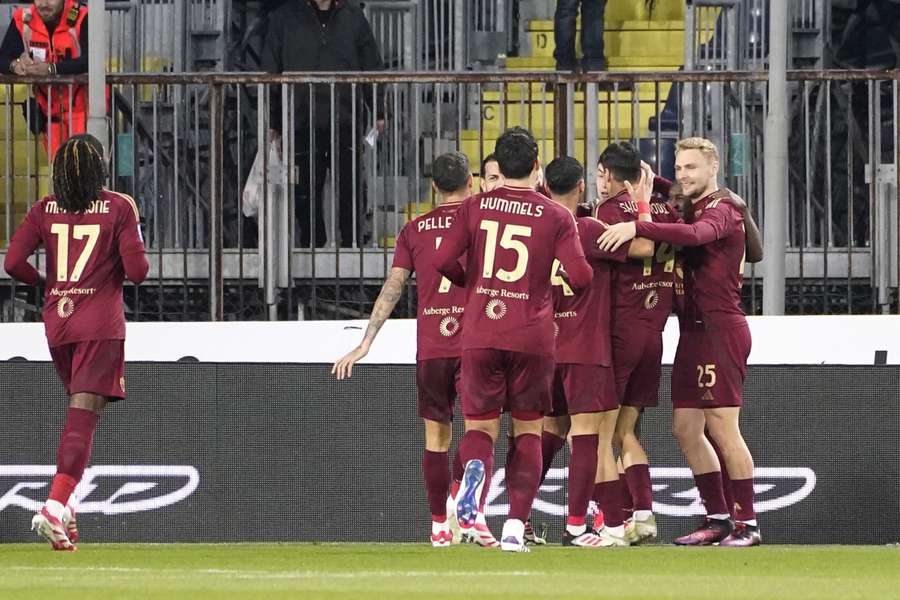 Roma celebrate the only goal of the game