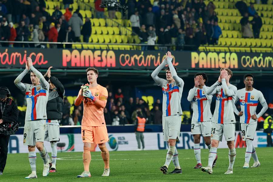 Barcelona's players celebrate victory at the end of their match against Villarreal