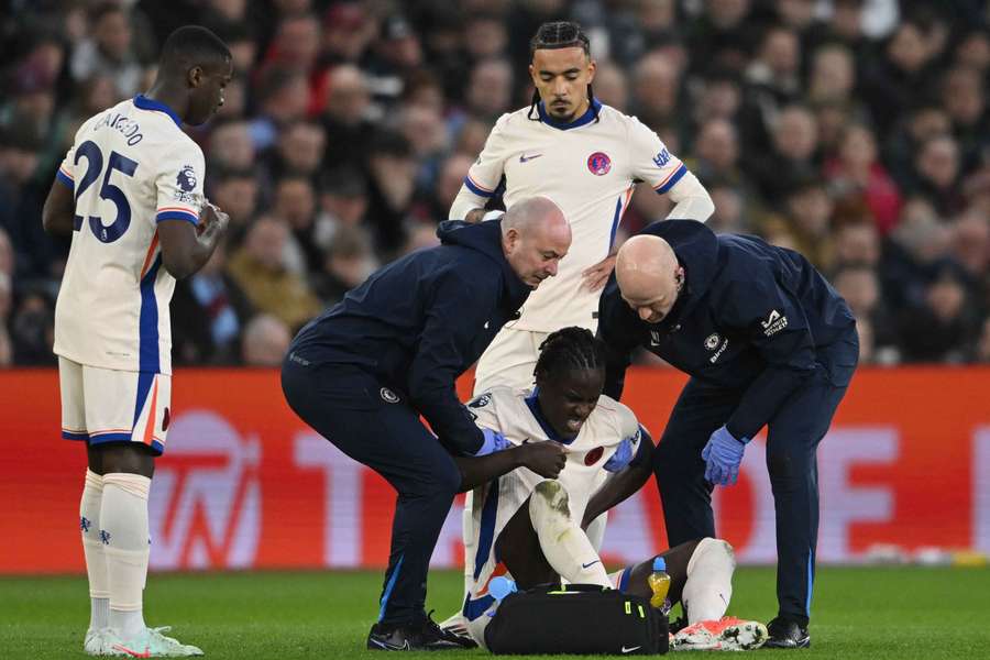  Chalobah receives medical attention after sustaining an injury
