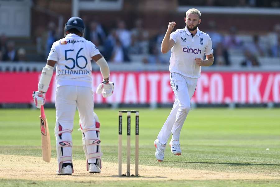 Gus Atkinson of England celebrates dismissing Dinesh Chandimal of Sri Lanka