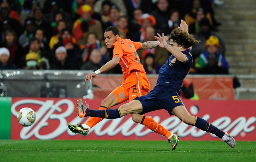 Van der Wiel attempts a cross against Carles Puyol during the 2010 World Cup final. Van der Wiel attempts a cross against Carles Puyol during the 2010 World Cup final.