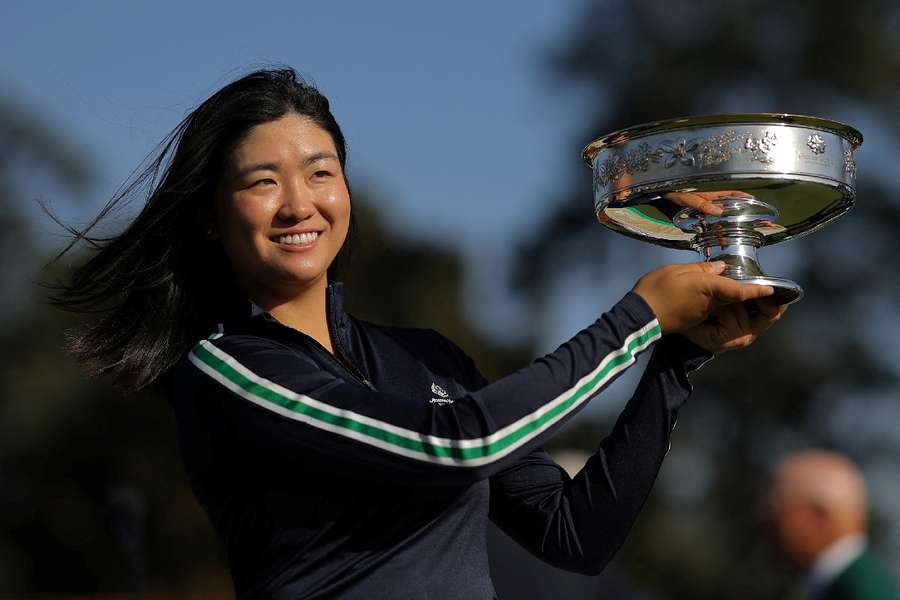 Rose Zhang poses with the trophy after winning the Augusta National Women’s Amateur 