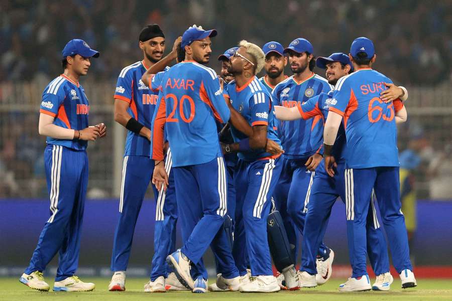 India's Jasprit Bumrah celebrates with teammates