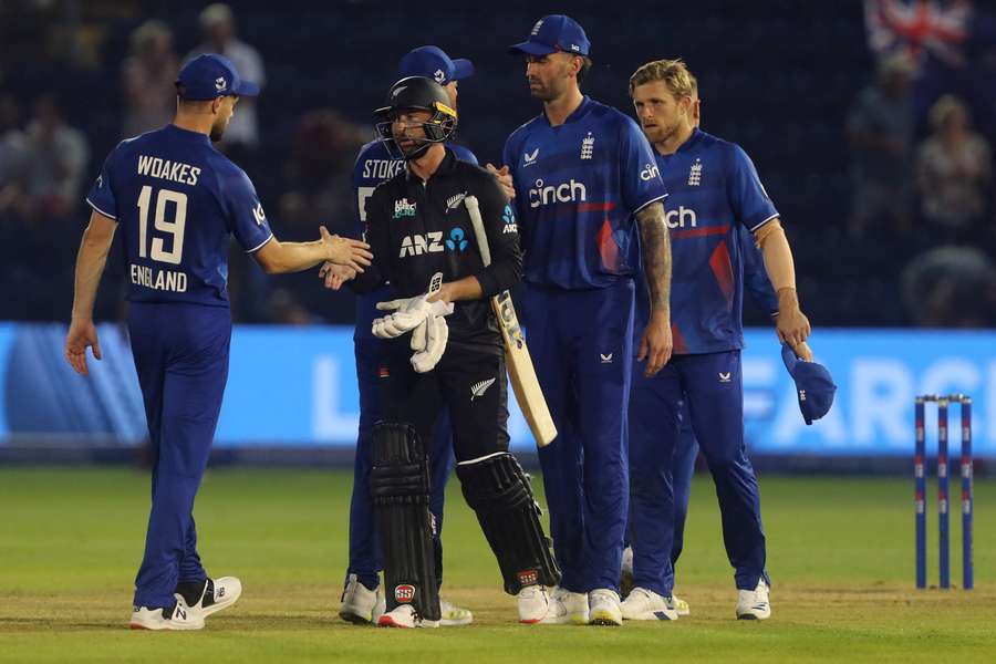 Players shake hands at the end of the first One Day International cricket match between England and New Zealand