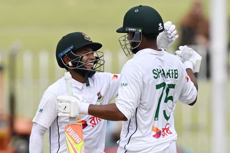 Bangladesh's Mushfiqur Rahim, left, and Shakib Al Hasan celebrate after winning the second test