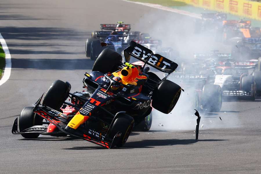 Red Bull Racing's Mexican driver Sergio Perez crashes during the start of the Formula 1 Mexico Grand Prix