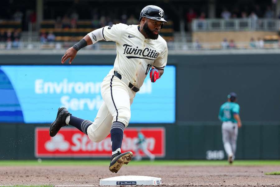 Minnesota Twins' Manuel Margot scores on a single hit by Carlos Santana against the Seattle Mariners during the first inning