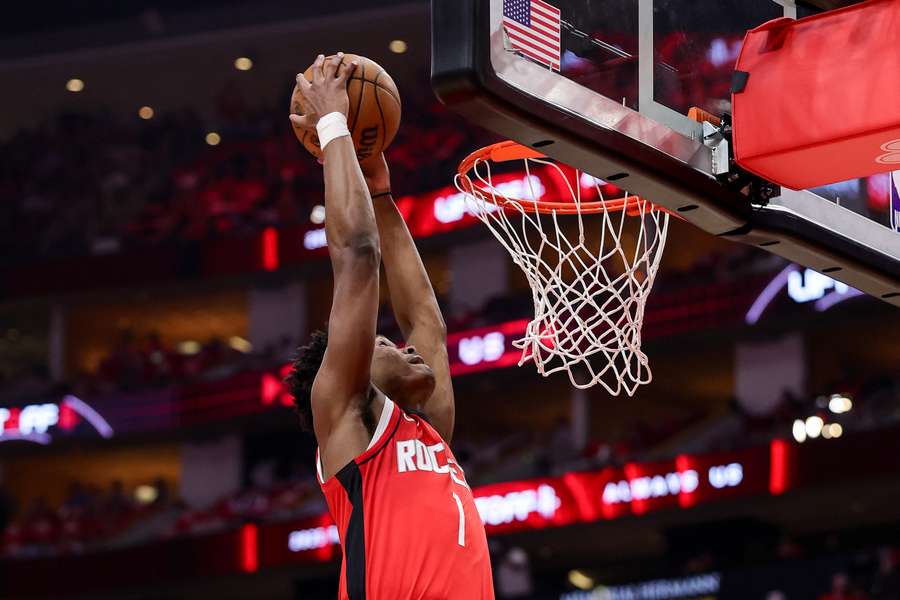 Amen Thompson finishes a dunk during the Houston Rockets' dominant win over the Golden State Warriors to stay alive in the NBA playoffs.