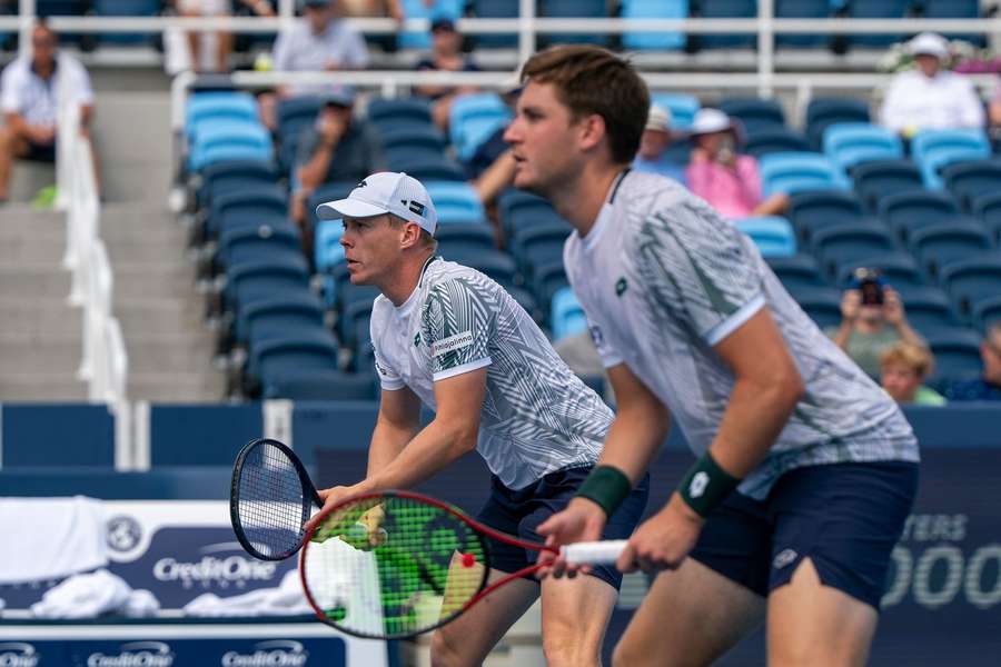 Heliovaara (background) and Patten in action at Flushing Meadows