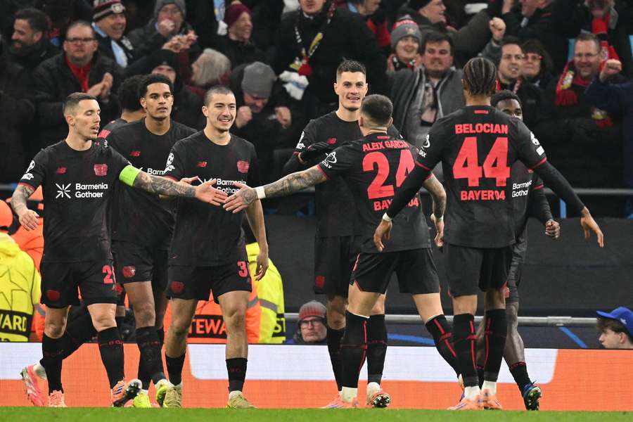 Patrik Schick celebrates with teammates after scoring Leverkusen's second goal against Man City