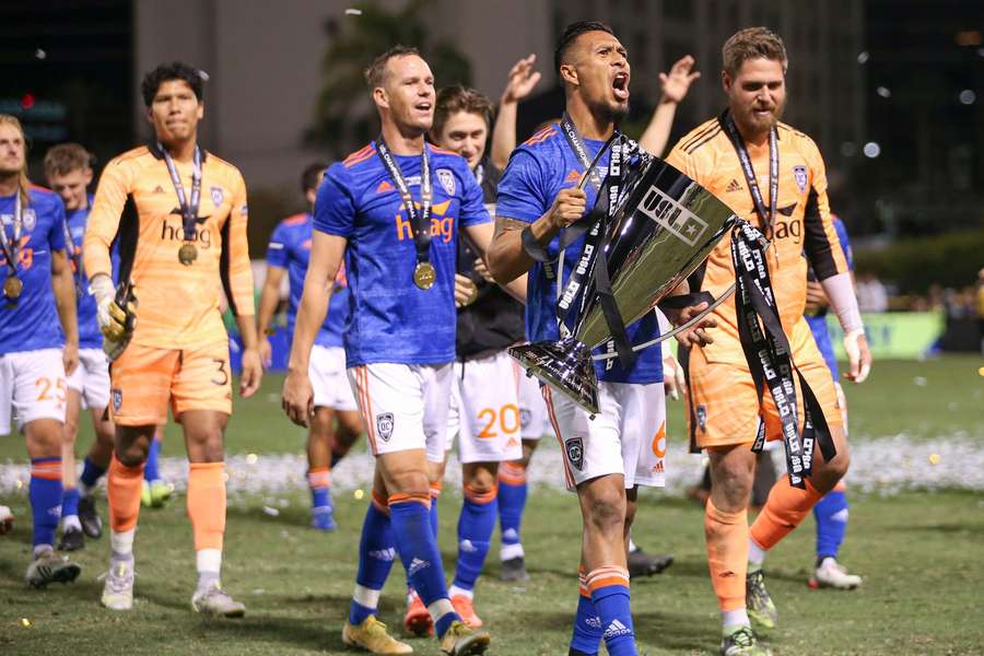 Orange County SC captain and defender Michael Orozco carries the trophy after the club win the 2021 USL Championship