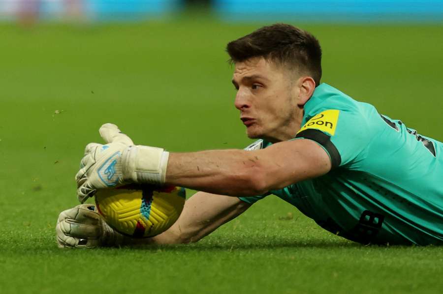 Newcastle United's Nick Pope handles the ball outside the area and is subsequently shown a red card 