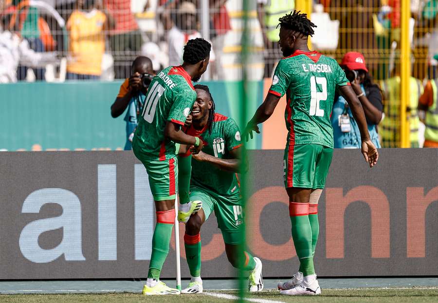 Burkina Faso's Bertrand Traore (L) celebrates with teammates after scoring his side's second goal