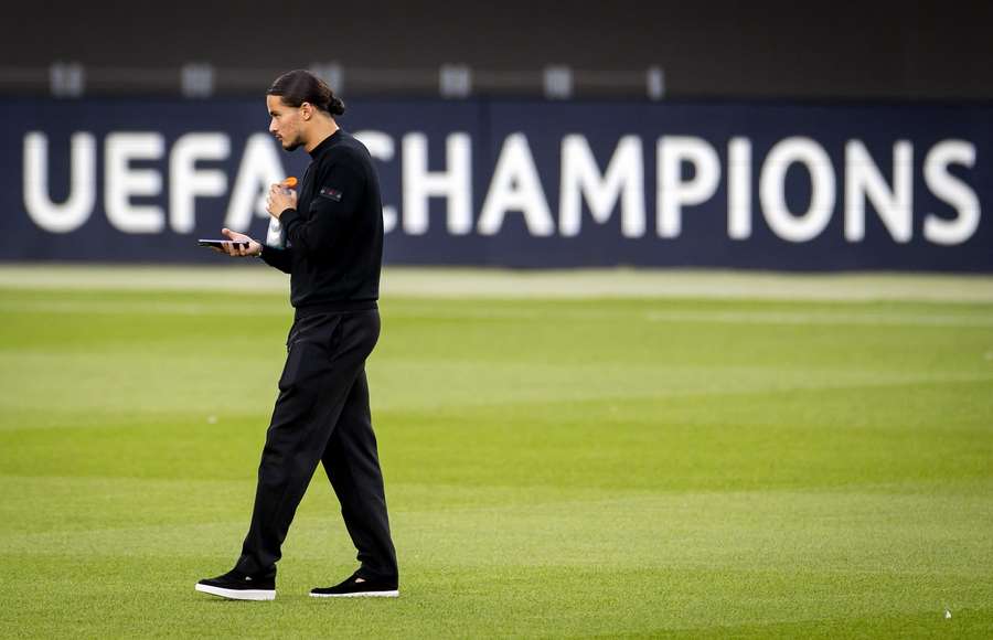 Anis Hadj Moussa inspects the pitch at Camp Nou