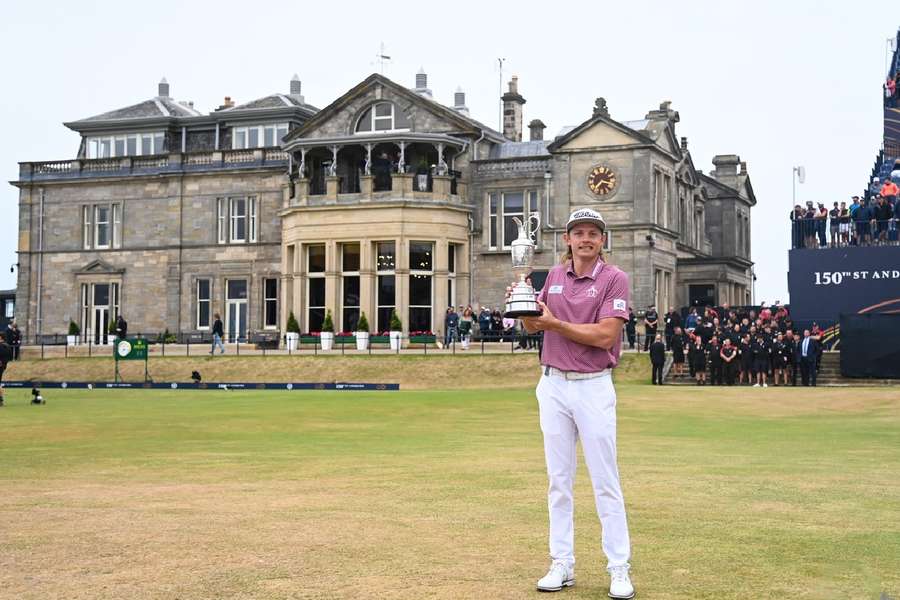 Smith posing with The Open trophy in 2022